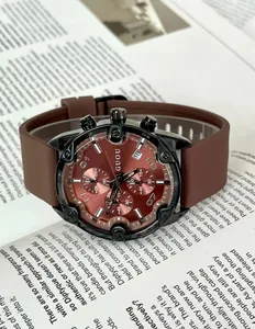 Close-up of GUOU chronograph watch with brown silicone strap and dark red dial