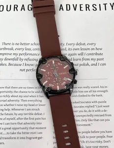 Detailed close-up of GUOU minimalist brown quartz chronograph watch with soft silicone strap