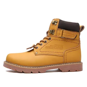 Side view of classic tan leather work boots with embossed details and rugged sole