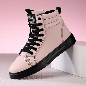 Close-up of pink high-top leather boots with black laces and durable rubber sole