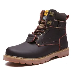Detailed side view of retro brown genuine leather men's outdoor work boots with rubber sole