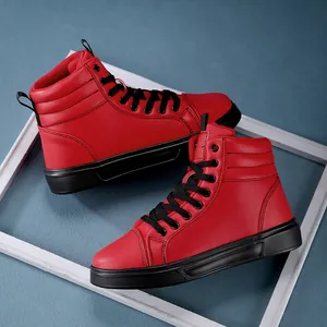 Close-up of vibrant red high-top boots with black laces on blue background.
