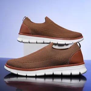 Comfortable brown men's fly-knit slip-on sneakers with lightweight white soles