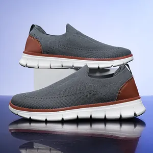 Men's lightweight grey fly-knit slip-on walking shoes with white textured sole