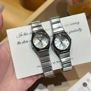 Elegante reloj de cuarzo GEDI para mujer con correa de acero plateado y calendario.