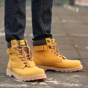 Detailed view of classic yellow leather work boots featuring durable anti-slip rubber soles