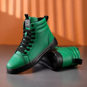 Close-up of vibrant green leather high-top fashion boots with black laces