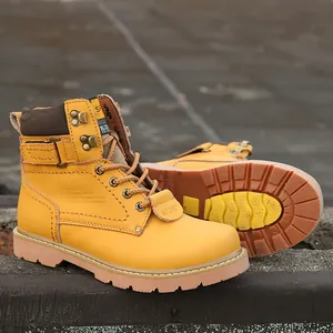 A high-quality close-up of yellow leather work boots with a durable rubber sole