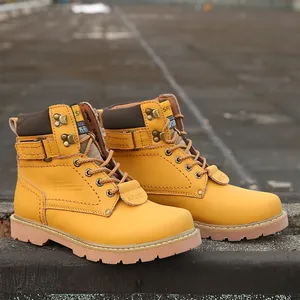 Detailed side view of yellow leather work boots with non-slip rubber soles