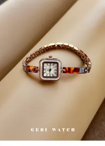 Vintage gold-toned square watch with tortoiseshell-patterned bracelet and Roman numeral dial