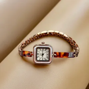 Vintage gold bracelet watch for women with tortoiseshell pattern and square dial
