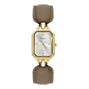 Elegant vintage gold rectangular quartz watch featuring a brown leather strap for women