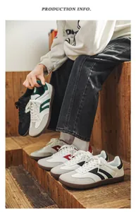 Close-up of stylish multi-color retro wide toe sneakers on vintage wooden stairs