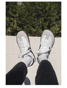 POV shot of person wearing stylish wide toe barefoot walking shoes with a classic T-toe