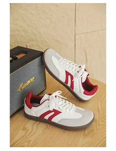 Detailed side view of barefoot wide toe walking shoes featuring red stripes and white leather