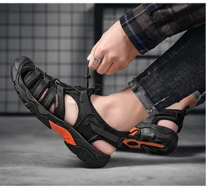Close-up view of men's breathable outdoor sport sandals with vibrant orange sole accents