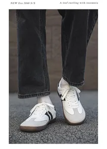 Close-up of stylish white and grey minimalist wide-toe barefoot training shoes for outdoors