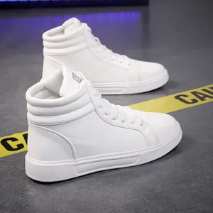 Detail view of white high-top leather fashion boots on a modern street-style background