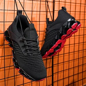Ademende heren sneakers met een zwart gebreid bovenwerk en opvallende rode zolen