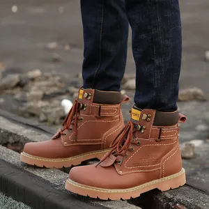 Close-up of brown leather men's work boots with durable rugged sole and buckle detail