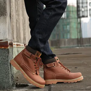 Detailed side view of rugged brown leather boots for men in a street setting