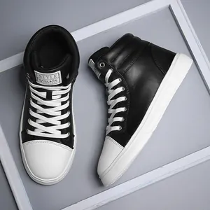 Top-down detail of black and white high-top leather fashion boots in a decorative frame