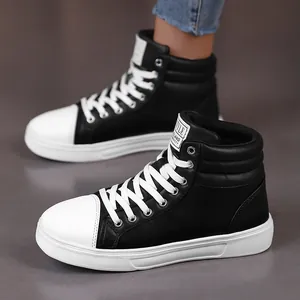 Side view of stylish black and white high-top leather boots for casual wear