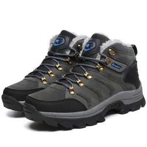 Close-up of grey waterproof winter hiking boots featuring faux fur lining and non-slip sole