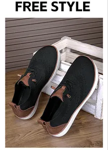 Close-up detail of breathable mesh upper on black wide toe box barefoot walking shoes