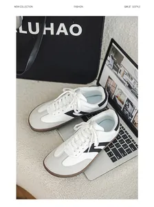 Stylish wide-toe barefoot sneakers in white and black for outdoor hiking and training.
