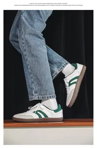 On-foot view of white and green wide-toe barefoot training sneakers with gum sole