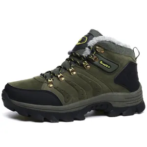 Close-up side view of olive green waterproof hiking boots with warm fur lining.