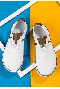 Top view of white breathable mesh barefoot shoes with brown accents and wide toe box.