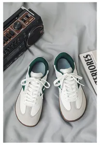Close-up lifestyle shot of retro white and green wide-toe barefoot hiking shoes
