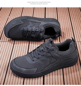Gedetailleerd macro-overzicht van donkergrijze barefoot wandelschoenen voor heren.