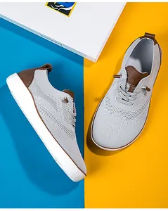Detailed view of breathable grey mesh hiking shoes featuring a wide toe box and brown accents