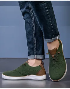 Men's green breathable mesh barefoot walking shoes with wide toe box design detail.