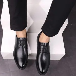 Professional men's black lace-up leather dress shoes shown on white stairs detail view