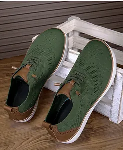 Close-up of breathable knit men's barefoot shoes with wide toe box and brogue details