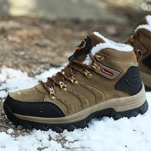 Side view of brown waterproof high-top snow boots with warm fur lining