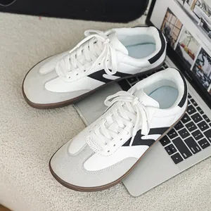 Professional white wide-toe barefoot hiking sneakers with black stripes and durable gum sole.