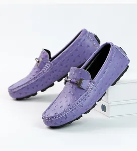 Close-up of purple ostrich texture men's loafers with white stitching details