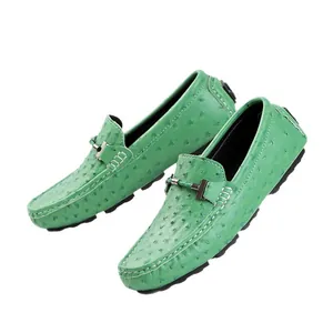 Stylish green men's casual loafers featuring ostrich texture and a sleek metal buckle