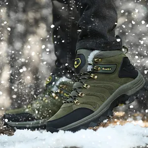 Close-up of green winter hiking boots in a snowy outdoor scene with warm lining.
