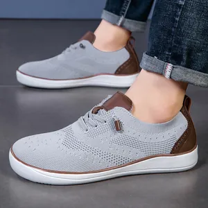 Men's grey knit wide toe barefoot shoes with brown Brogue accents and white soles