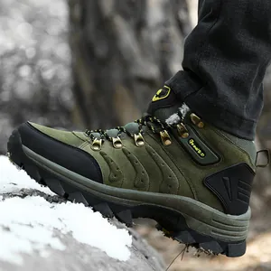 Detail view of durable green waterproof hiking boots with warm fur lining shown in the snow