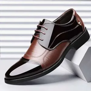 Elegant men's brown and black patchwork leather business dress shoes for formal wear.