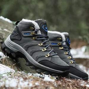 Detailed view of durable grey high-top winter hiking boots with warm faux fur lining