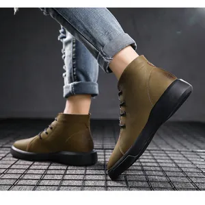 Side view detail of men's olive green genuine leather work boots with durable black soles