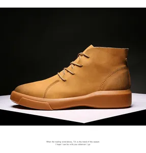 Side view of tan leather men's work boots with rubber sole in high quality detail